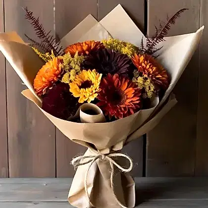Orange Burgundy Yellow Gerbera Bouquet with fresh green foliage